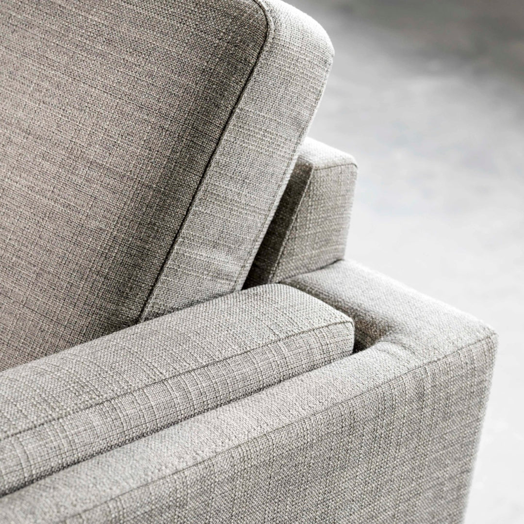 Gray upholstered chair from fjords  showcasing top quality fabric